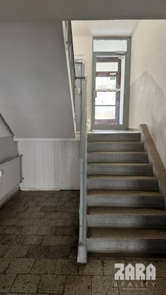 The staircase leads from the ground floor to the first floor of the panel building.