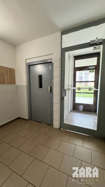 Entrance hallway with an elevator in a 2-room apartment on Sofijská Street, Sídlisko Ťahanovce, Košice.
