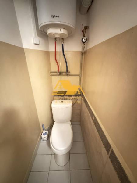 A toilet with a boiler in a 2-room apartment.
