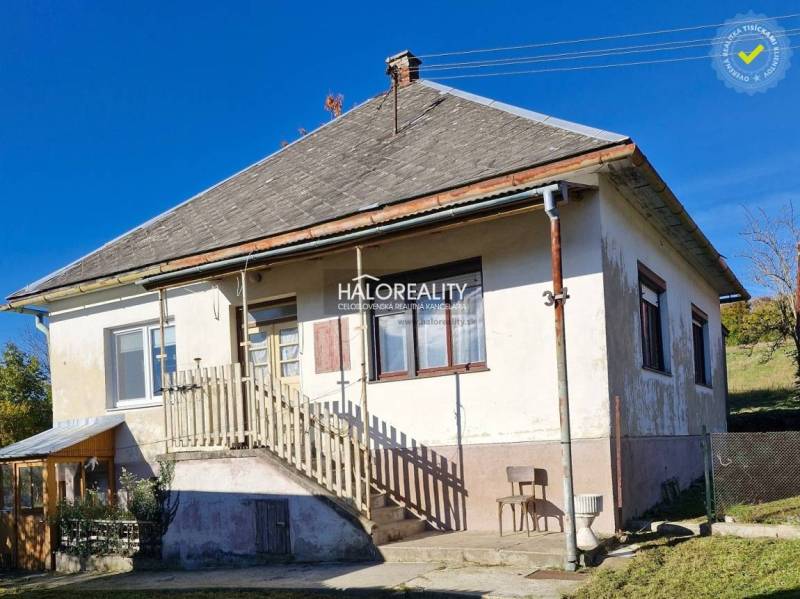 A family house in Malá Lehota with a pitched roof, staircase, and garden.