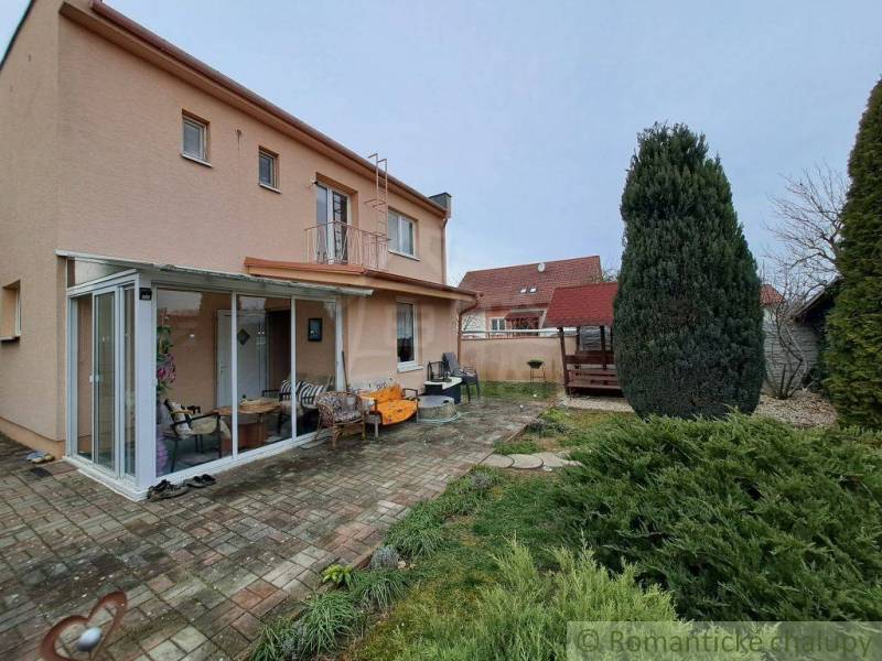 A family house in Veľké Ripňany with a terrace, a winter garden, and a well-maintained garden.
