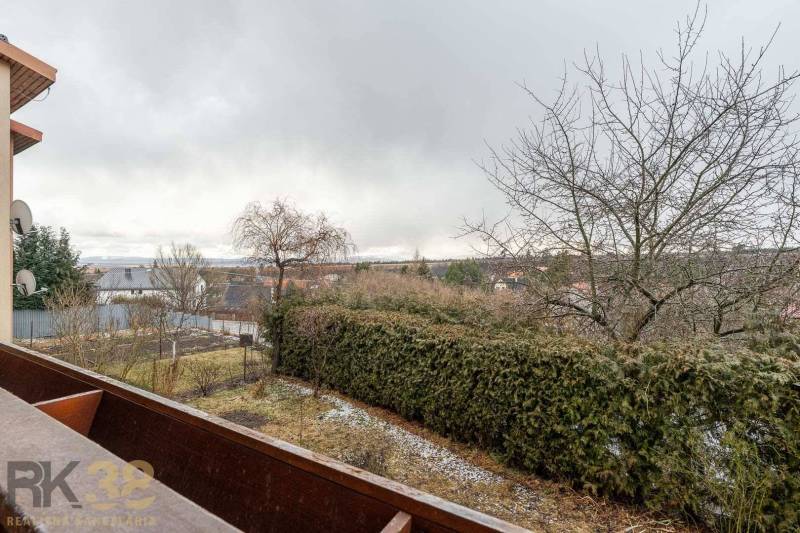 View from a 5 or more room apartment in Stará Lesná to the garden and surrounding houses.