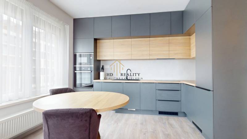 A kitchen in a 3-room apartment with wooden decor and large windows.