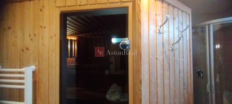 A sauna with wooden paneling in a two-room apartment.