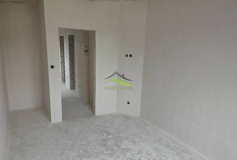 A white room with passages in a family house, ready for completion.