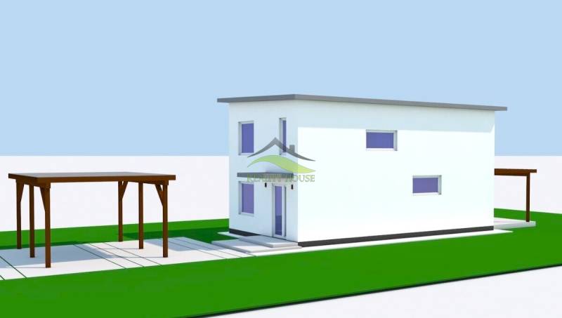 A family house in Michalovce with a white facade and a shelter, green grassy areas.