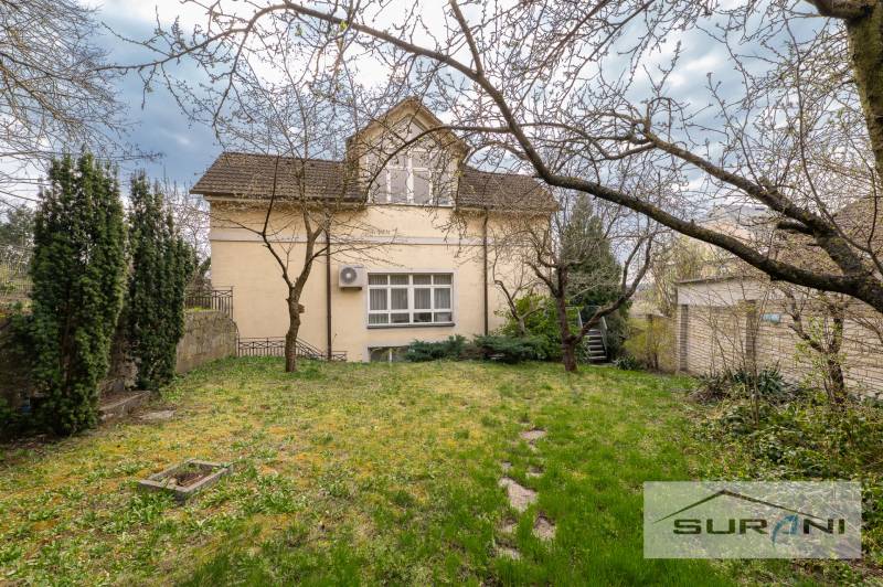 A family house with a spacious garden and ornamental trees on Krčméryho Street in Bratislava.