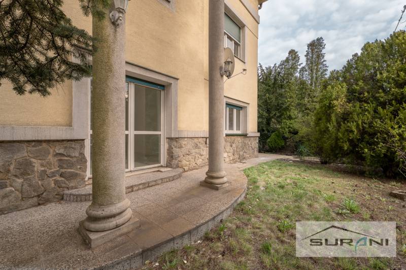 The exterior of the house with stone cladding and a small porch on Krčméryho in Bratislava - Staré Mesto.