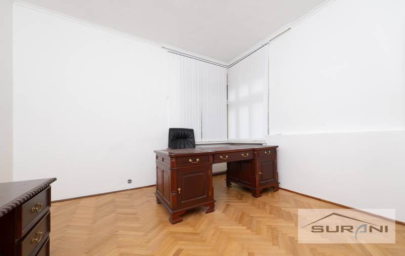 Office space with wooden furniture and a wooden decor floor in a 4-room apartment.