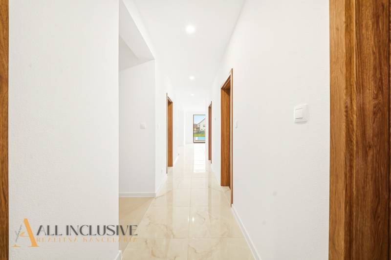 Interior of a family house with light walls and a gres floor.