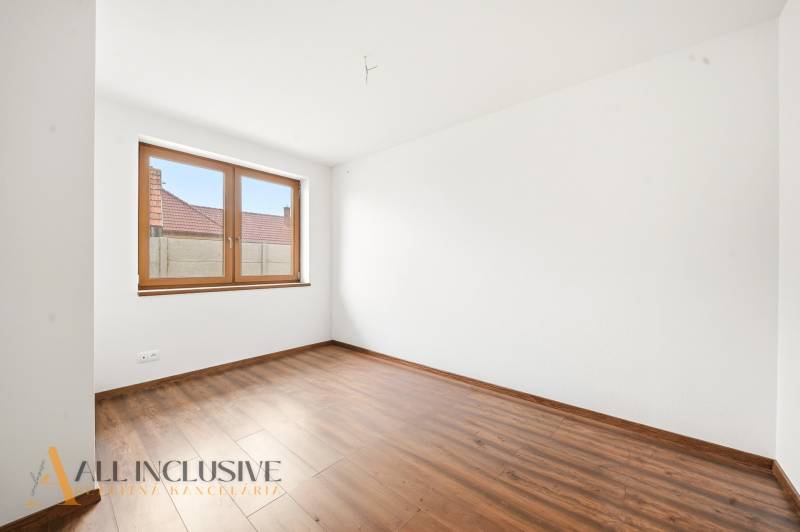 White wall and floor with wood decor in the room of a family house.