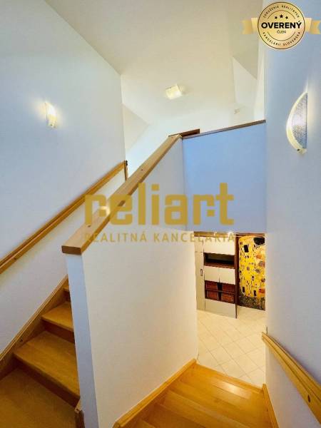 Interior of a family house with a staircase and a wooden decor floor.