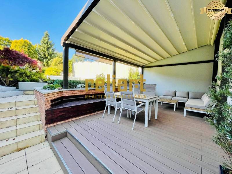 Terrace of a family house with seating and a pergola on Kozičova Street, Bratislava - Devín.