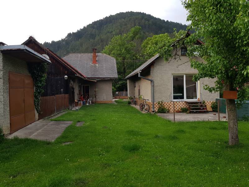 A family house in Blatnica on Blatnica Street surrounded by greenery with a view of the forest.