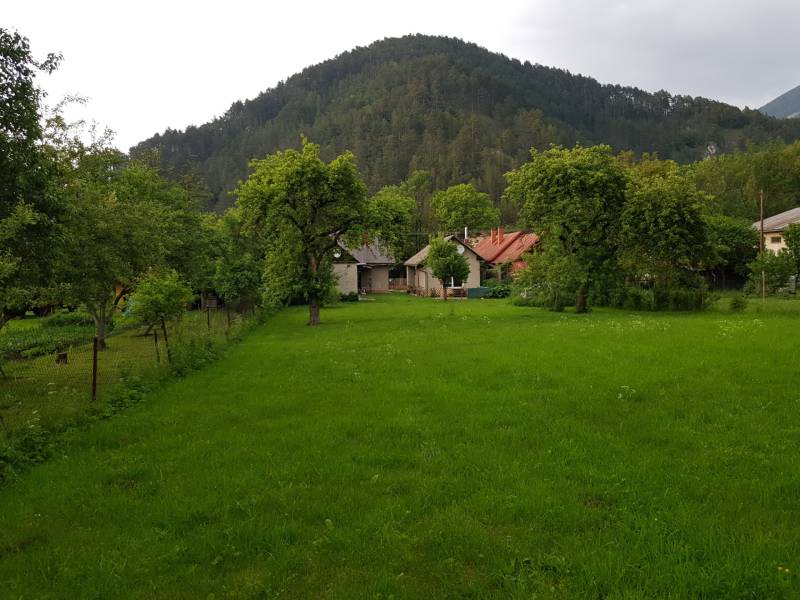 A family house in Blatnica on Blatnica Street surrounded by greenery and trees.