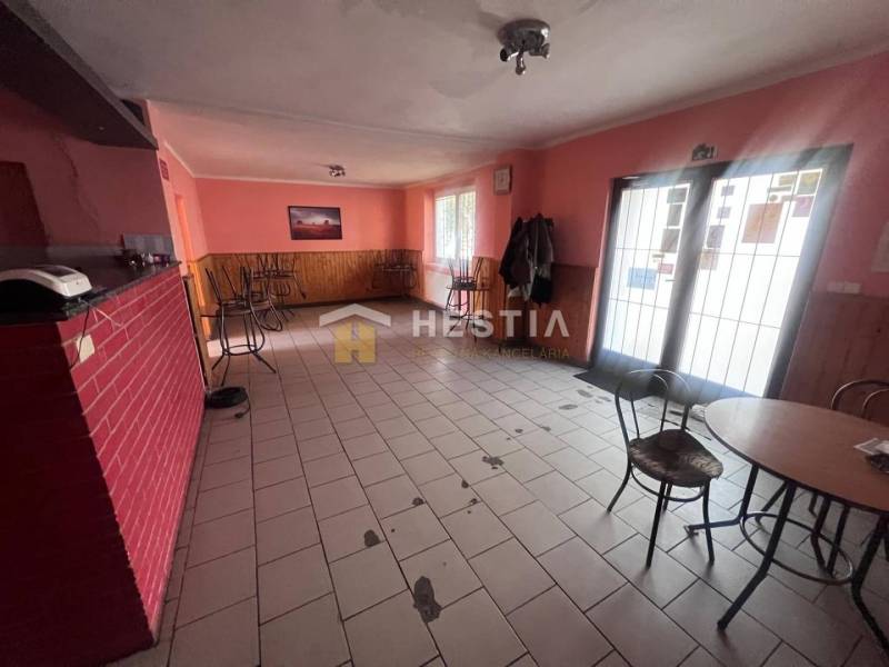 A café with a brick wall and empty chairs, gastro spaces.