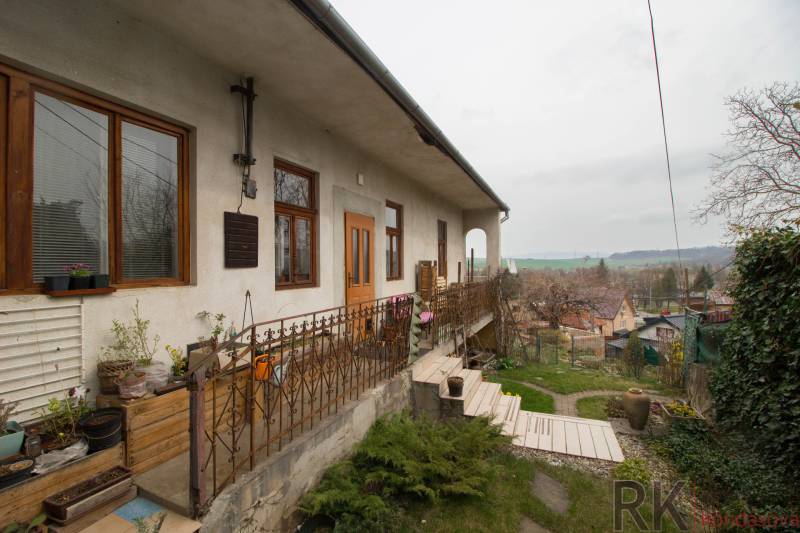A family house in Kostoľany nad Hornádom with a terrace, garden, and a view of the surroundings.