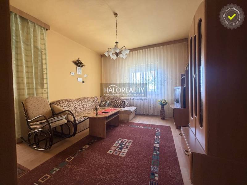 Living room in a family house with a comfortable sofa and a wooden decor floor.