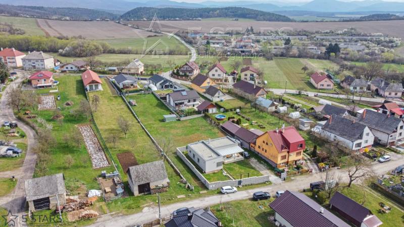 A view of family houses in Neporadza on Bošianska Street from a bird's eye perspective.