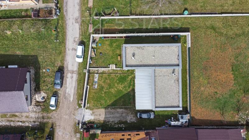 Aerial view of a family house on Bošianska Street in Neporadza with a grassy yard.