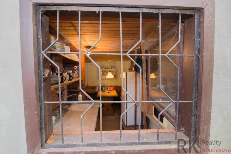 A meticulously designed interior kitchen with wooden decor and a cozy atmosphere of recreational properties.