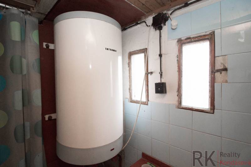 A boiler in an interior with blue tiles on recreational grounds.