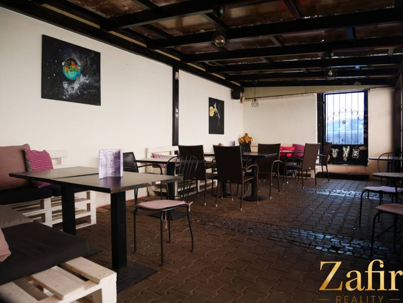 Comfortable seating in cozy gastro spaces with art on the walls.