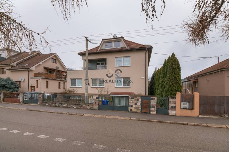 Liberators Street, house with a 2-room apartment, Trenčín, with fences and trees.