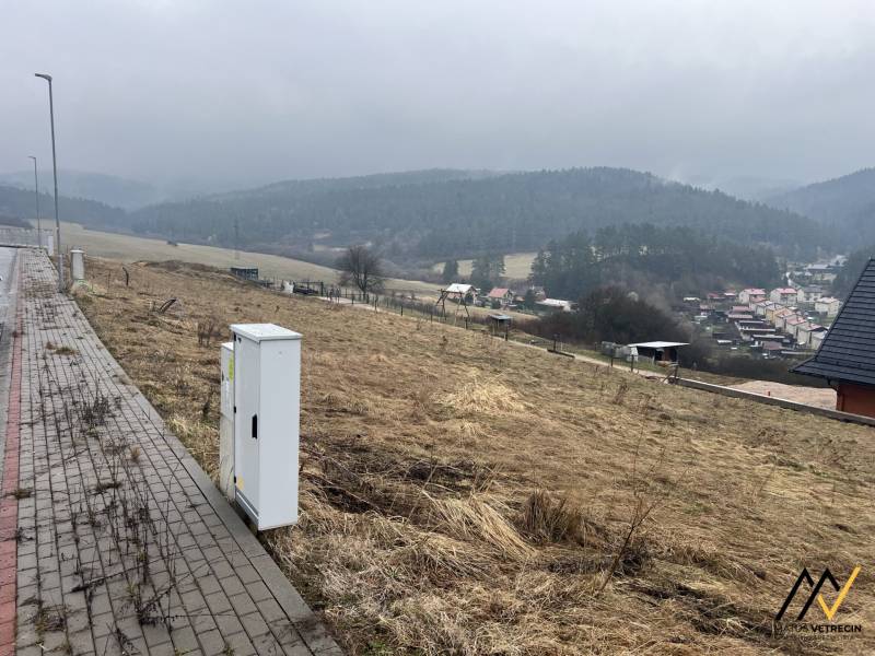 Residential plots in Stará Ľubovňa with a view of lush green hills.