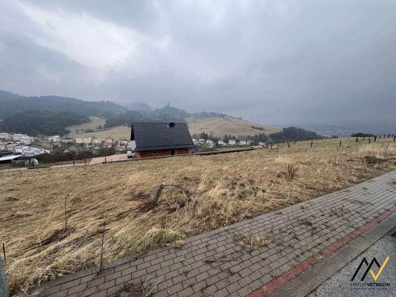 Foggy view from residential plots in Stará Ľubovňa with a house and trees.