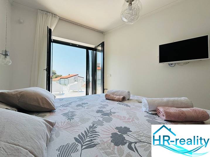 Bedroom in a villa with a view, bed, and television, ideal for relaxation.