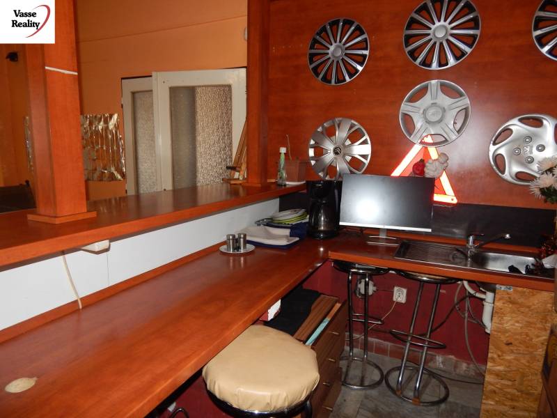 Interior with a bar and hubcap decoration on the wall in gastronomy spaces.