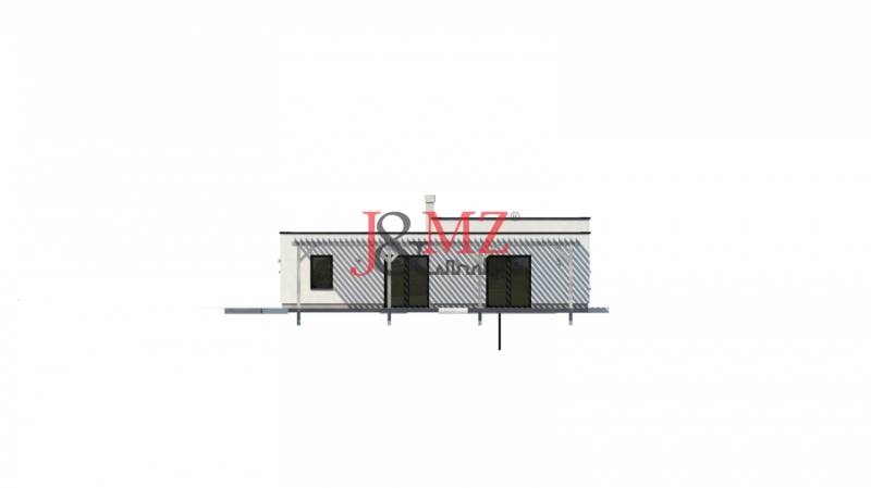 A family house in Dolná Seč with a simple facade and glass doors.