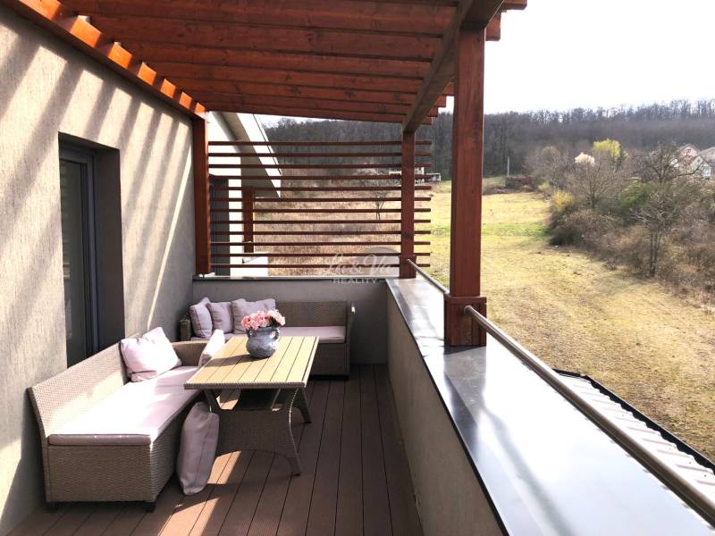 View from the terrace of a 2-room apartment in Podhájska on Svätuša, with comfortable seating.
