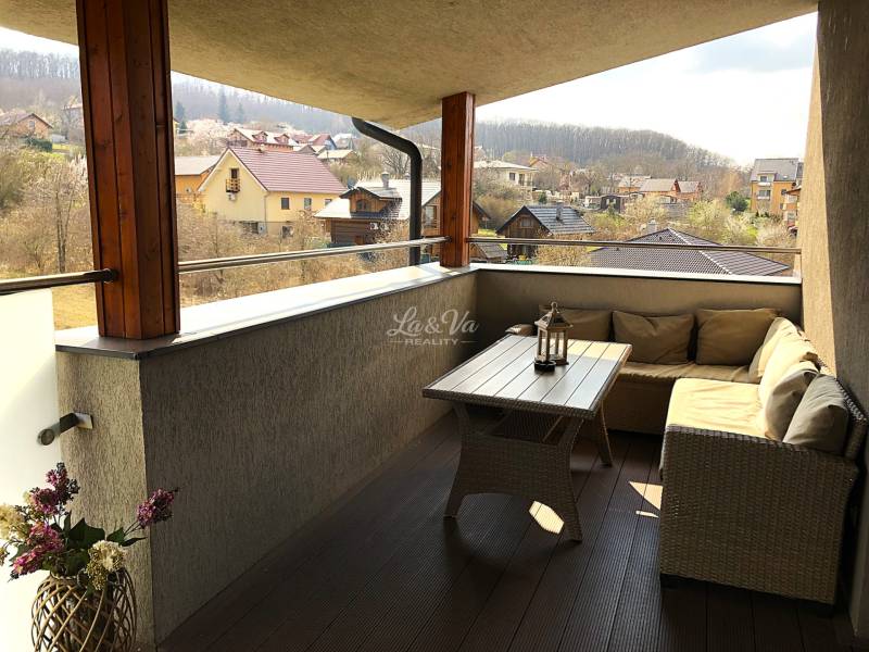 Furnished terrace of a 2-room apartment with a view of the surrounding countryside of Podhájska, Svätuša Street.