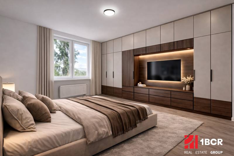 A bedroom in a 3-room apartment with a large bed, cabinets, and a TV on the wall.