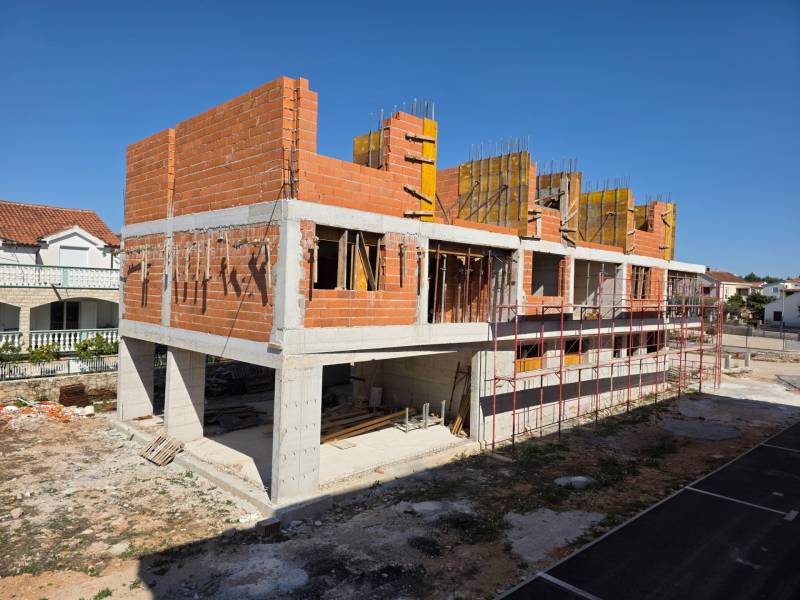 Construction of a 3-room apartment in Srima, with visible unfinished brick walls.