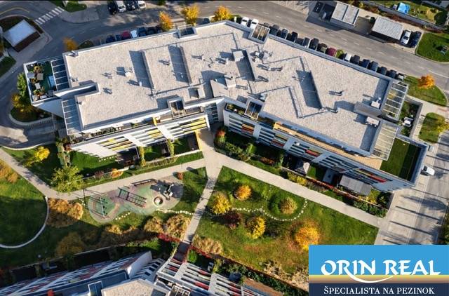 Apartment complex with a playground on Malokrasňanská in Bratislava - Rača, top view.