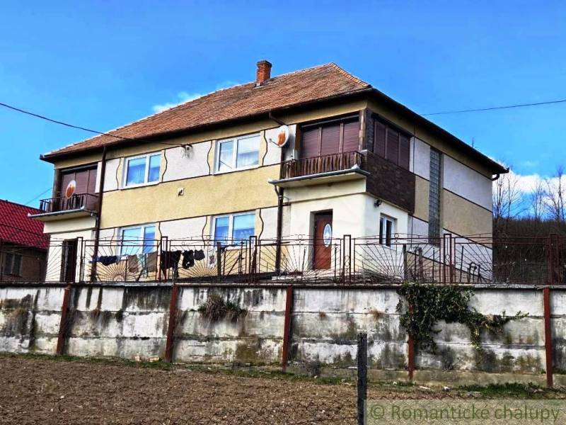 A family house in Kiarov with two floors and a brown roof.