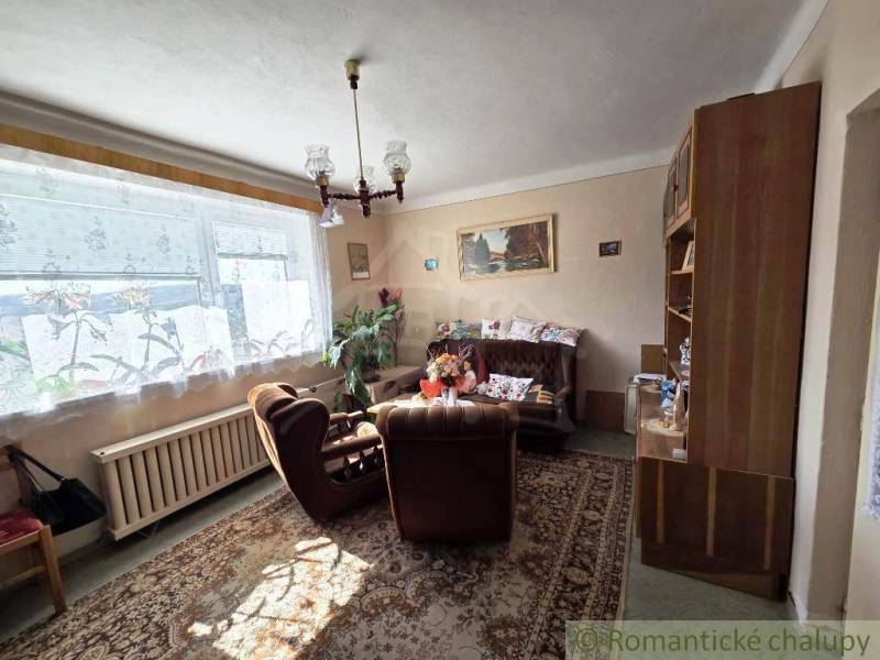 Living room in a country style in a family house with carpet decor.