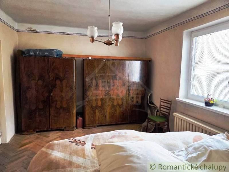 Interior of a family house with classic furniture and a wooden decor floor.