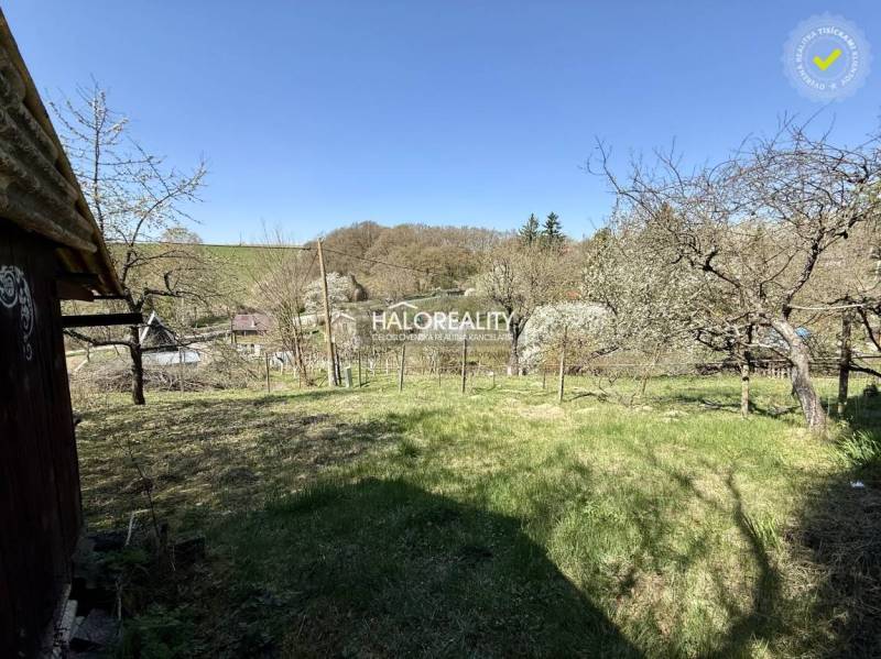 Gardens in Rimavská Sobota with lawns and trees, overlooking the surrounding landscape.