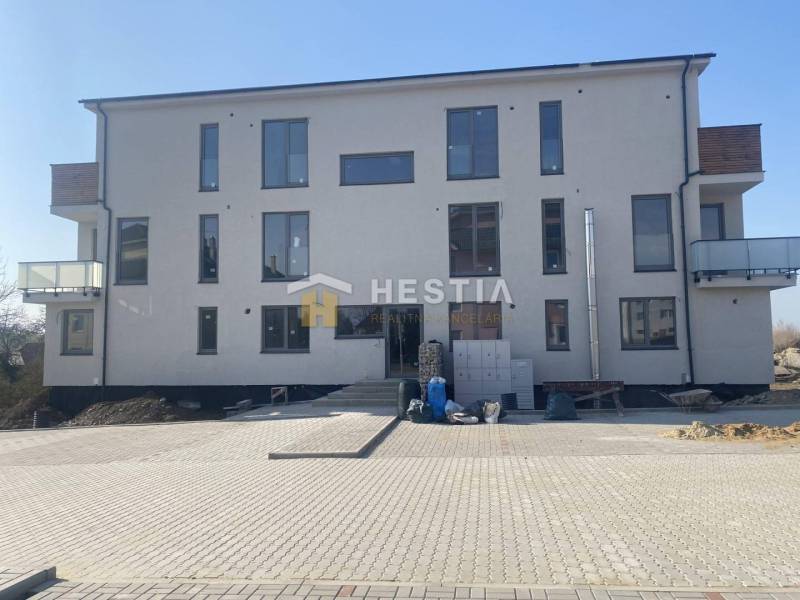 The picture shows a new building with balconies, suitable for a 2-room apartment.