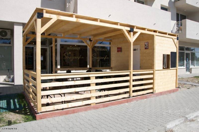 Wooden terrace in front of the café on Dukelská Street in Bernolákovo, suitable for gastro spaces.