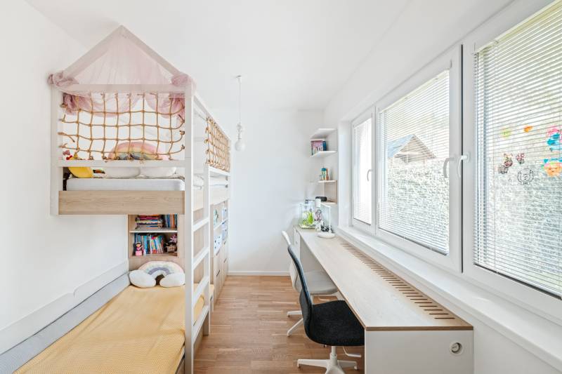 A children's room with a bed and a desk in a 4-room apartment.