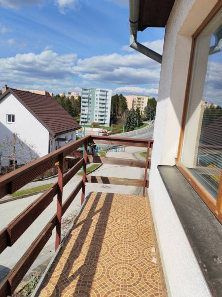 A balcony of a family house on Závršky Street in Myjava with a view of the surrounding buildings.