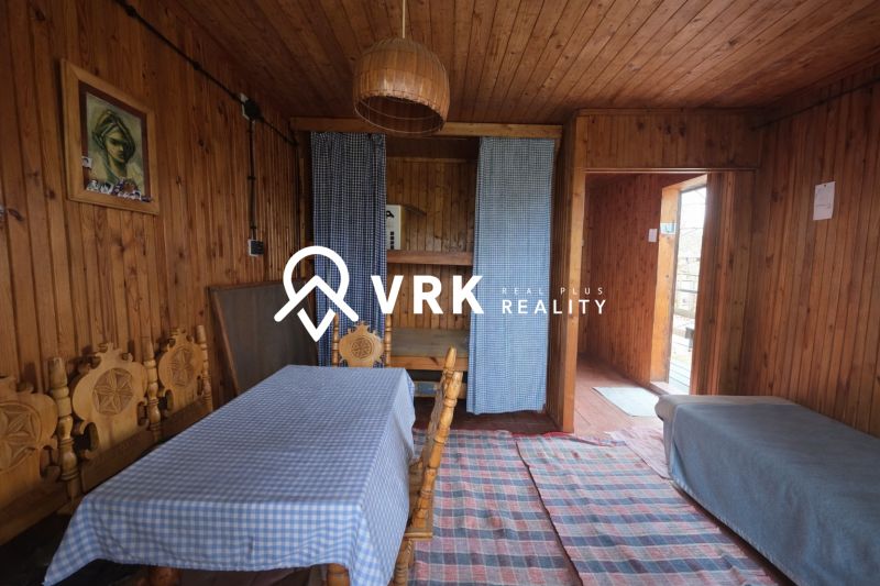 Wooden interior with a dining table, sofa, and curtains, Properties - living.