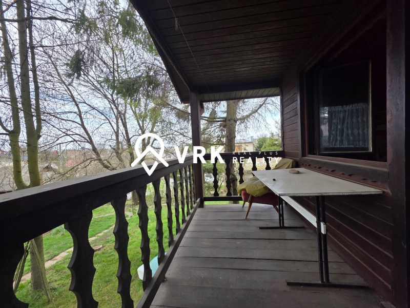 Wooden terrace with a garden view in the location of Bohdanovce for Residential Land.