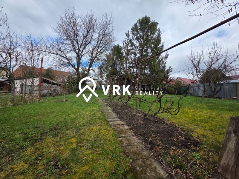 A garden in Bohdanovce with a lawn and trees, ideal for residential plots.