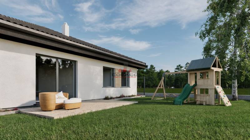 The exterior of a family house on Kostolná Street in Drahovce with a terrace and a children's playground.